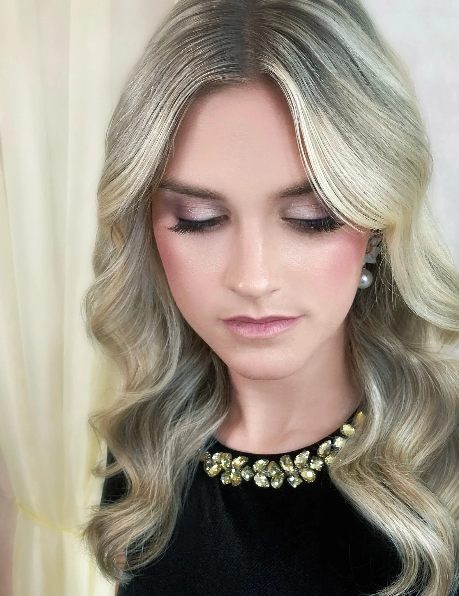 Bridal hair styling with elegant waves by Glow Salon & Spa in Carmel, Indiana
