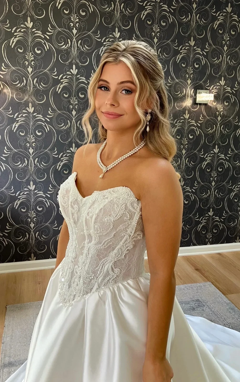 Blonde bride with half-up waves and soft-glam makeup