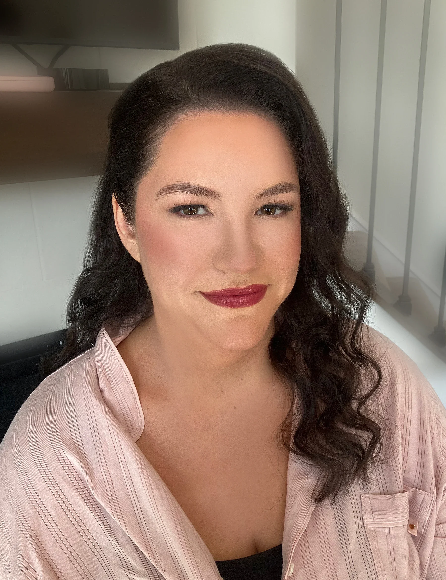 Bride getting ready with professional hair and makeup in Carmel, Indiana