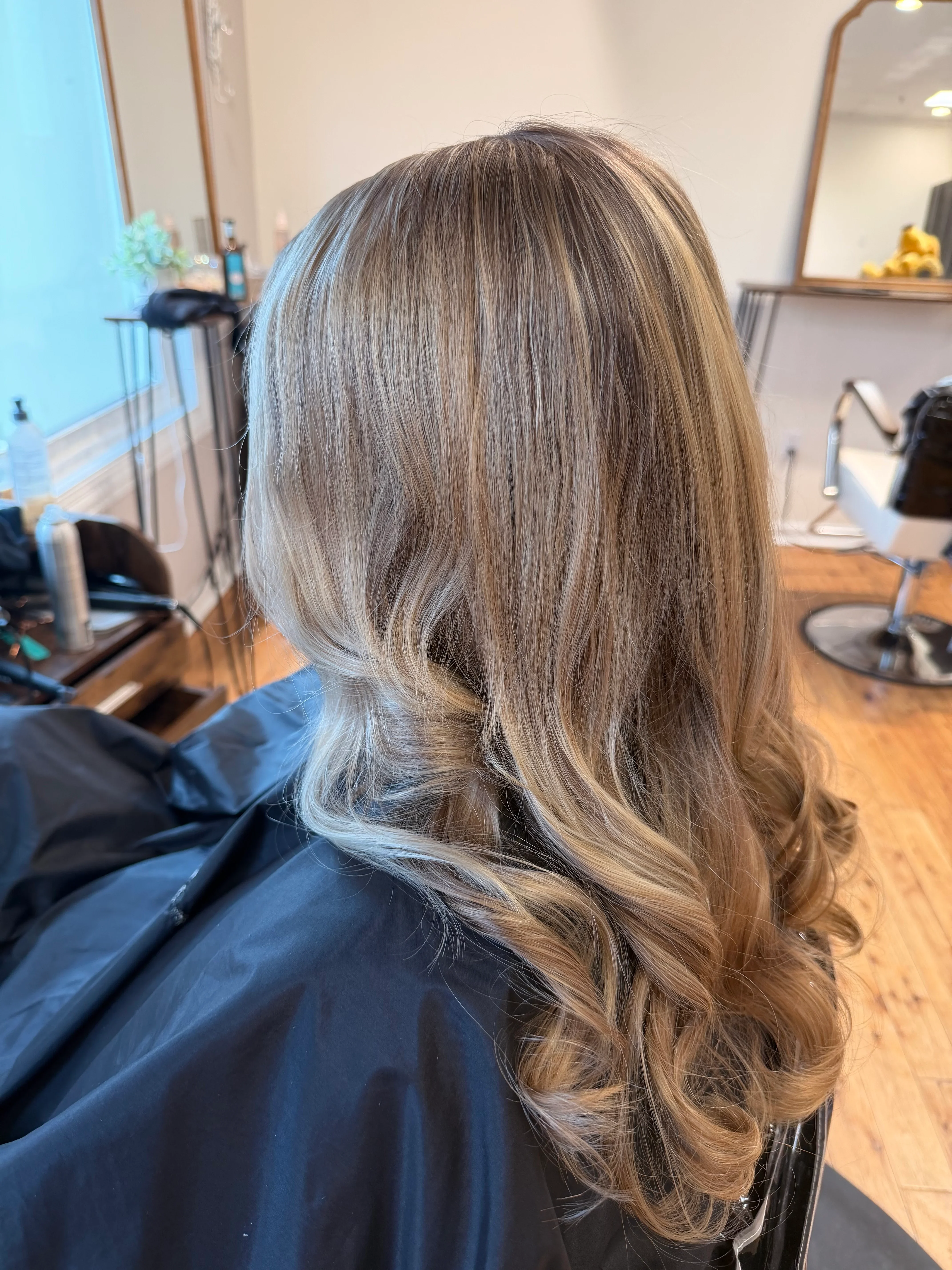 Professional hair styling at Glow Salon & Spa in Carmel, Indiana