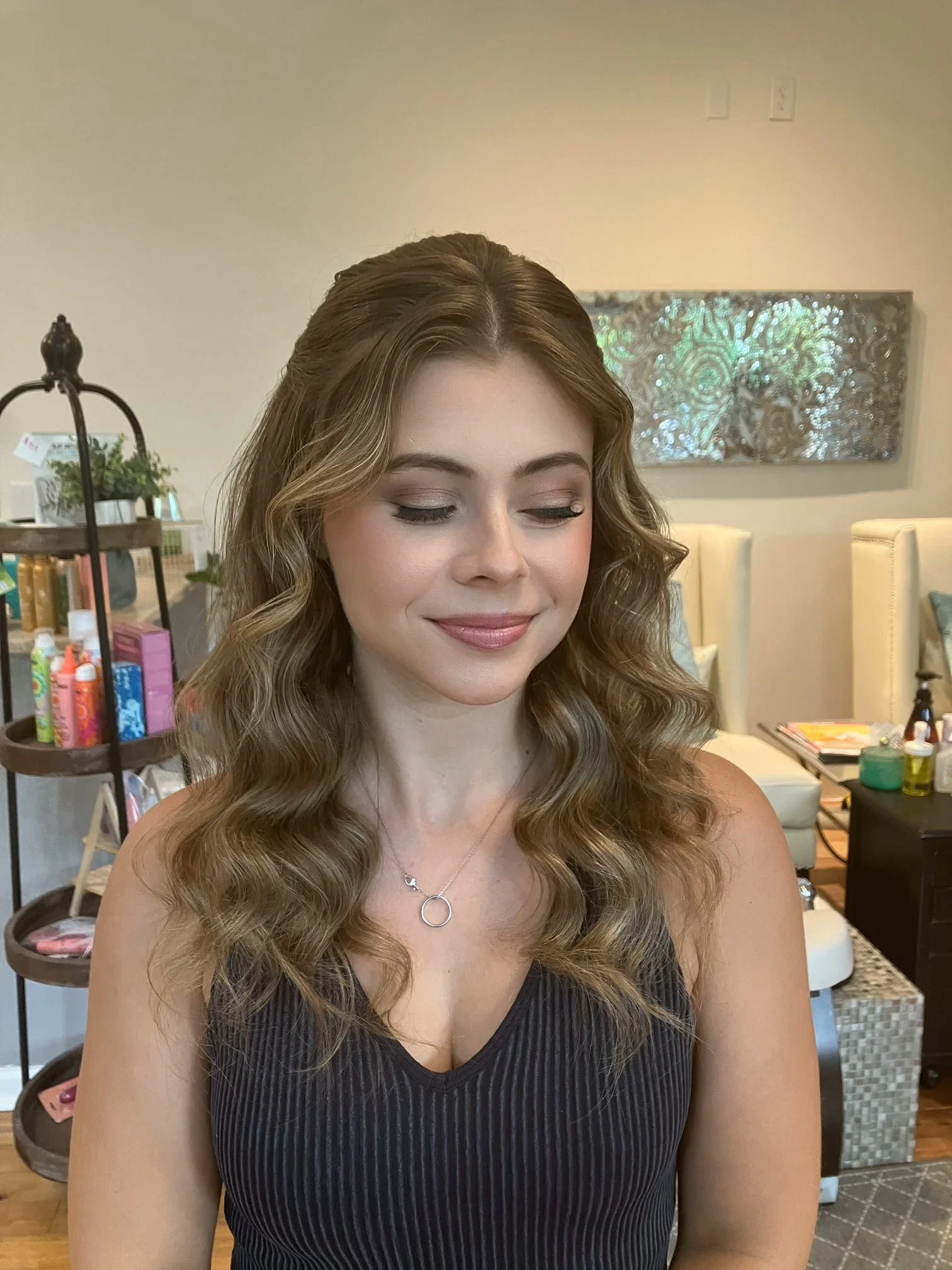 Portrait showing soft-glam eye makeup and long blonde waves for a wedding