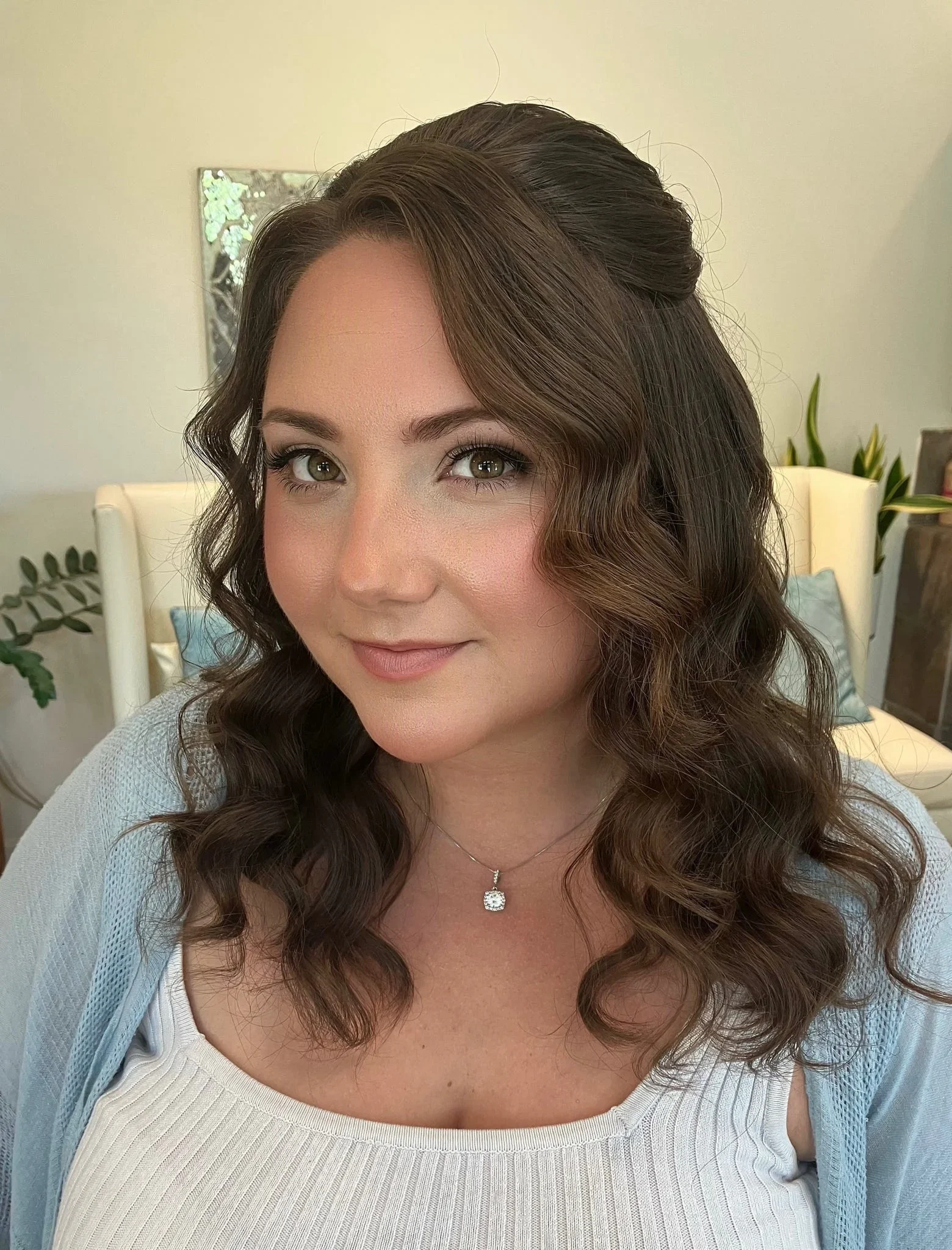 Bride with half-up soft waves and polished bridal makeup by Glow Salon & Spa in Carmel, Indiana
