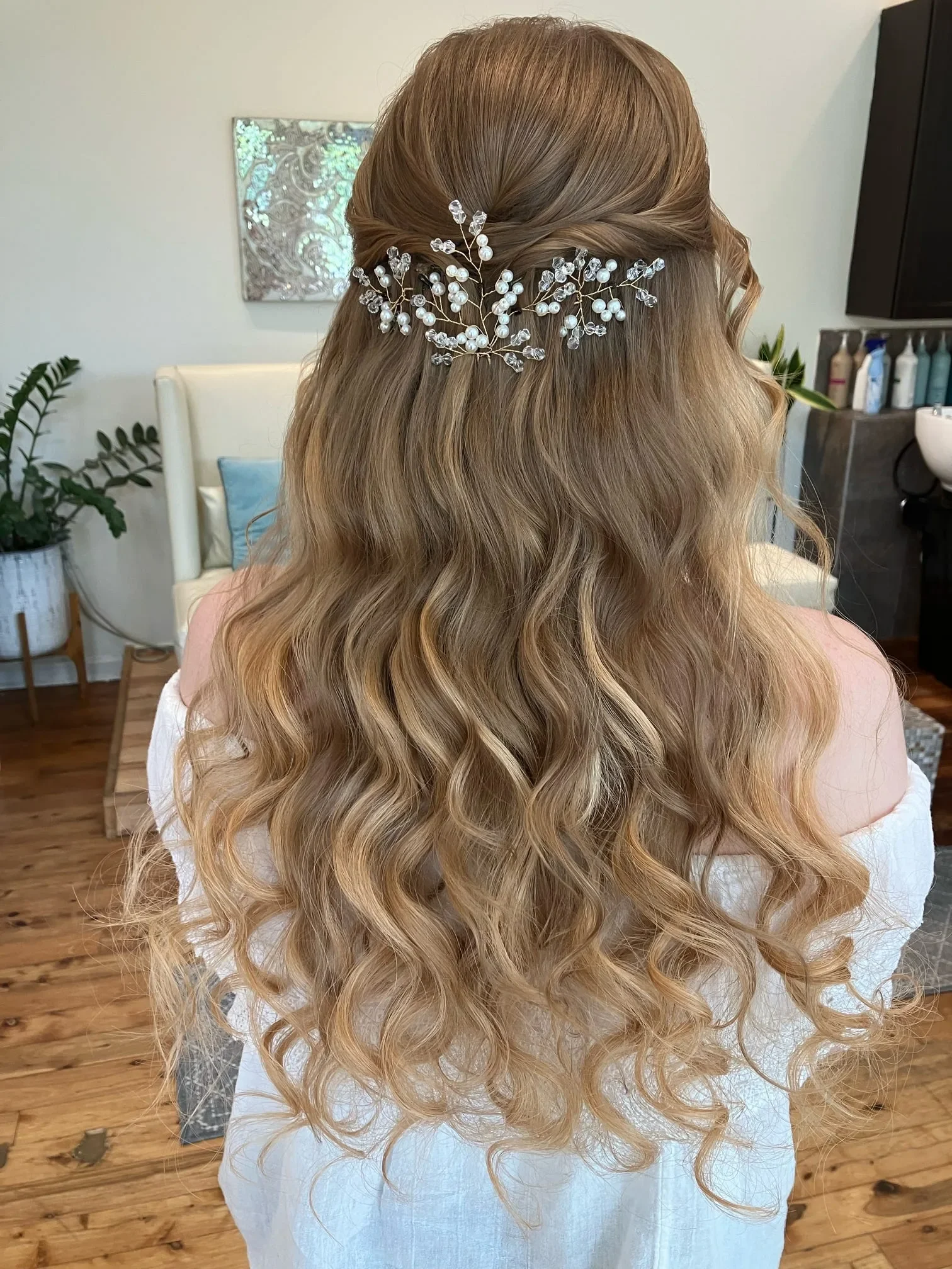 Strawberry blonde half-up bridal waves with a pearl and crystal hair vine by Glow Salon & Spa